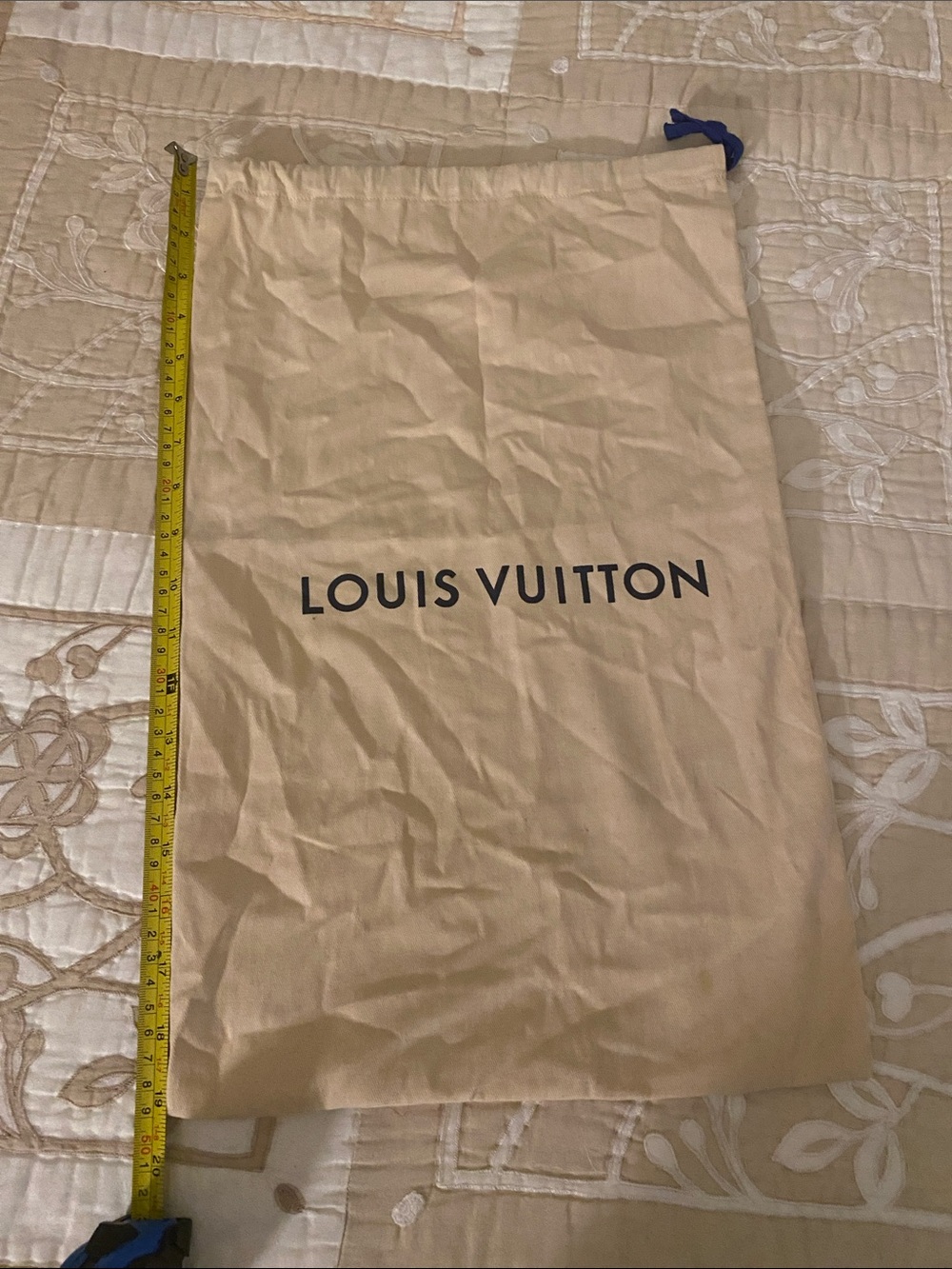 Louis Vuitton beige drawstring dust bag with navy tie